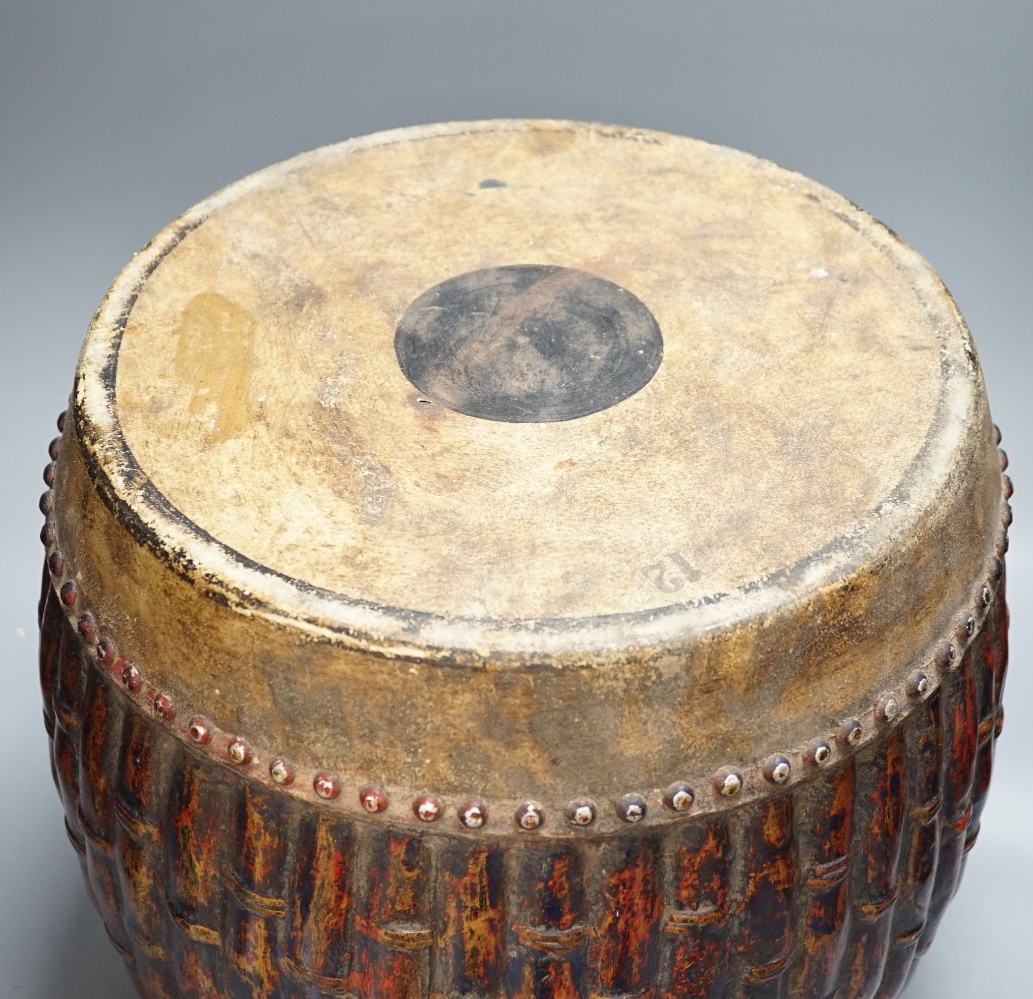 A Chinese bamboo-effect double sided temple drum, 37cm